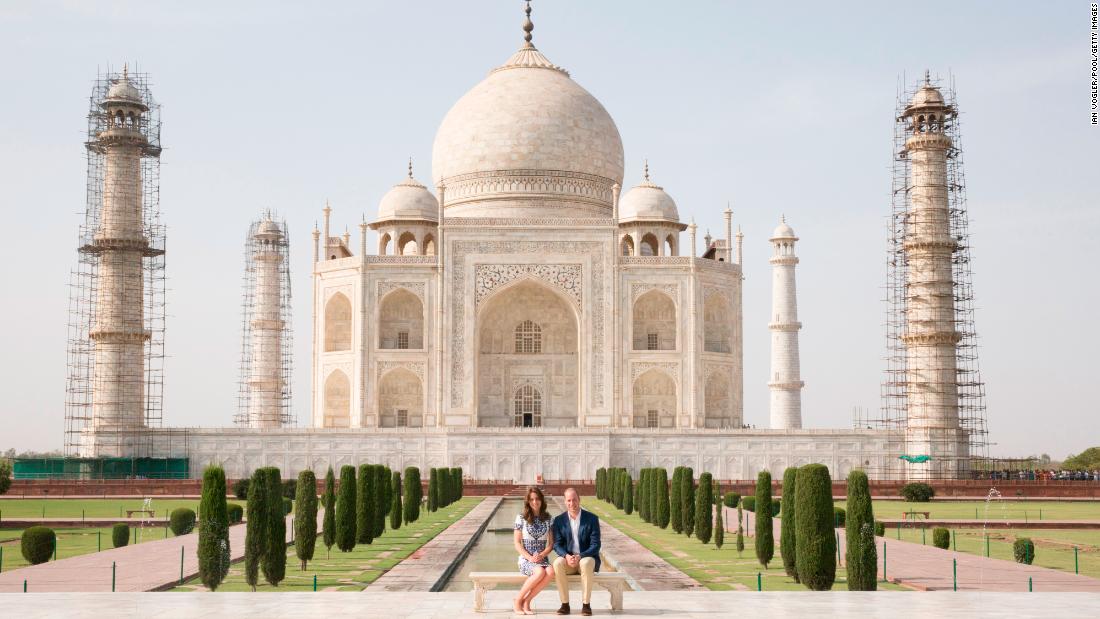 William and Catherine sit in front of the Taj Mahal while on a royal tour of India in April 2016.