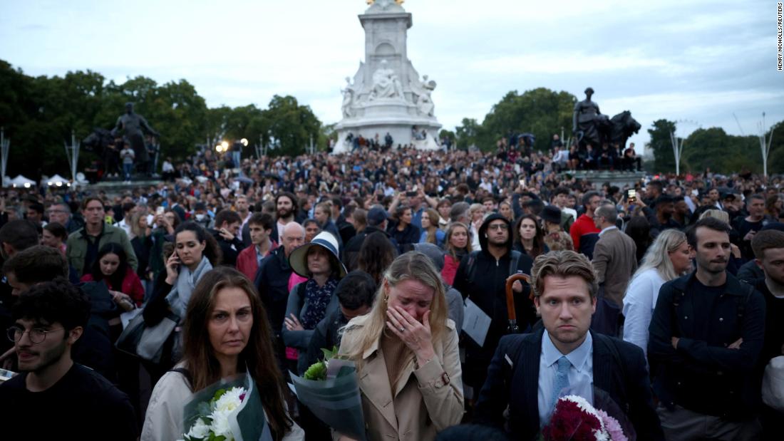 Under the rain, crowds paid respects to the Queen at Buckingham Palace