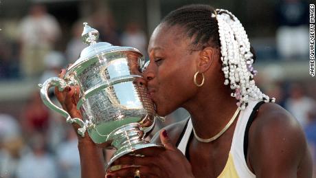 Williams accepts the trophy after defeating Martina Hingis in the US Open final. 