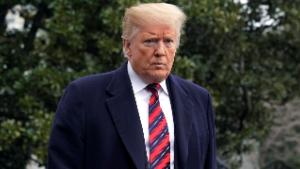 U.S. President Donald Trump walks to talk to the media, ahead of his departure to Dover, on the South Lawn of the White House in Washington, U.S., January 19, 2019. REUTERS/Yuri Gripas