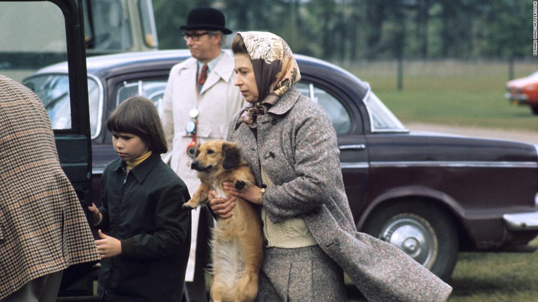 The Queen holds one of her &quot;dorgis,&quot; a cross between a corgi and a dachshund, in 1960. She is credited with creating the breed after her corgi mated with a dachshund owned by her sister, Princess Margaret. 
