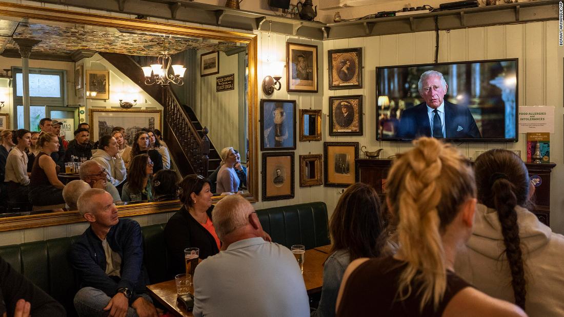 People watch Charles&#39; televised speech inside a pub in London on September 9. &quot;As the Queen herself did with such unswerving devotion, I too now solemnly pledge myself, throughout the remaining time God grants me, to uphold the Constitutional principles at the heart of our nation,&quot; he said.