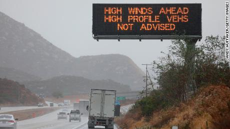 A travel advisory sign is posted for high winds on Interstate 8, East of San Diego, on Thursday in Julian, California.  