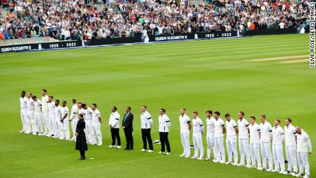 Players and spectators observe a minute silence, as LED boards around the stadium pay tribute to Her Majesty Queen Elizabeth II.