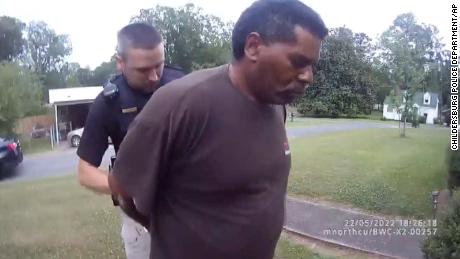 This image captured from bodycam video released by the Childersburg, Alabama, Police Department and provided by attorney Harry Daniels shows Michael Jennings, right, in custody in on May 22, 2022. 