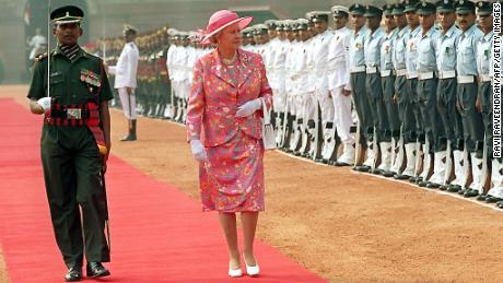 Britain&#39;s Queen Elizabeth II inspects a guard of honor at the Presidential palace in New Delhi during her visit to India in 1997. 