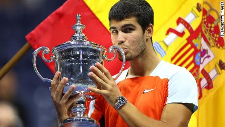 Carlos Alcaraz celebrates with the US Open trophy after defeating Casper Ruud in the final on September 11.