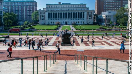 Students walk around the Columbia University campus in Manhattan, New York, on August 16, 2021. 