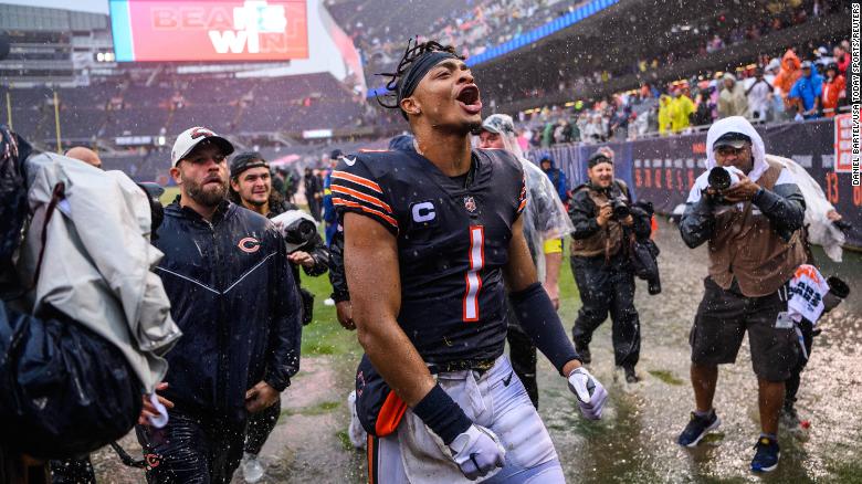 Chicago Bears quarterback Justin Fields celebrates after the Bears&#39; 19-10 win against the San Francisco 49ers at Soldier Field. Fields threw for two touchdowns on a rain-soaked day in Chicago.