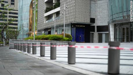 A closed shopping mall is seen on a street during lockdown amid the coronavirus disease (COVID-19) pandemic, in Shanghai, China April 14, 2022. 