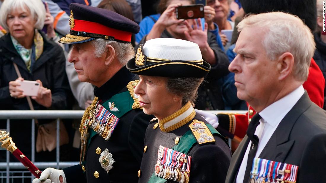 From left, the King, Princess Anne and Prince Andrew follow the hearse through the streets of Edinburgh on September 12.