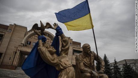 The Ukrainian flag waves after the Ukrainian army liberated the town of Balakliya in the southeastern Kharkiv oblast, Ukraine, on September 11, 2022. 