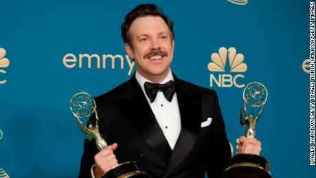 Jason Sudeikis holds his Emmys for &quot;Ted Lasso&quot; at the 2022 Emmy ceremony.