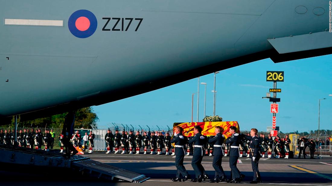 The coffin is carried into a Royal Air Force plane in Scotland on Tuesday.