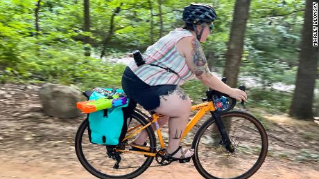 Cycling and body-size inclusion activist Marley Blonsky hits the Black Apple Creek Trail in Bentonville, Arkansas.