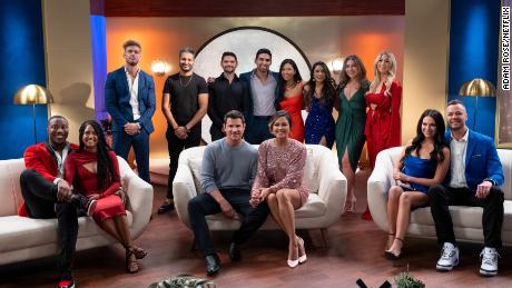 The main cast of season two of &quot;Love Is Blind&quot; is pictured during the show&#39;s reunion episode alongside hosts Nick and Vanessa Lachey (front row, center).