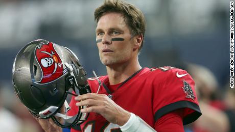 Brady prepares to take the field for the Bucs against the Cowboys.