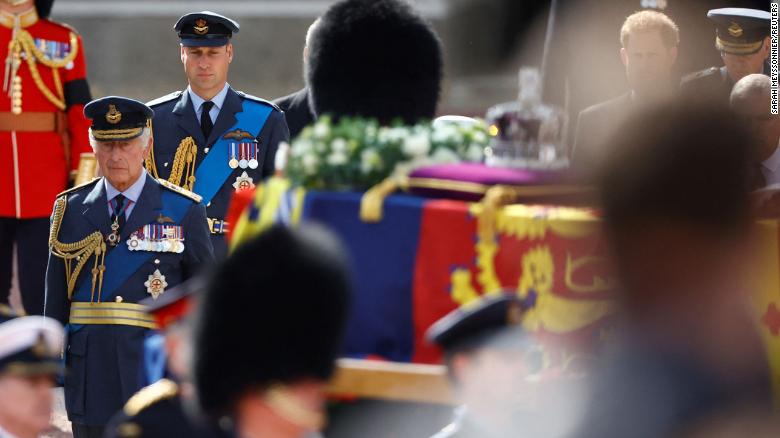 Britain&#39;s King Charles and his son, Prince William, march behind the Queen&#39;s coffin as it travels from Buckingham Palace to the Houses of Parliament for her lying in state.
