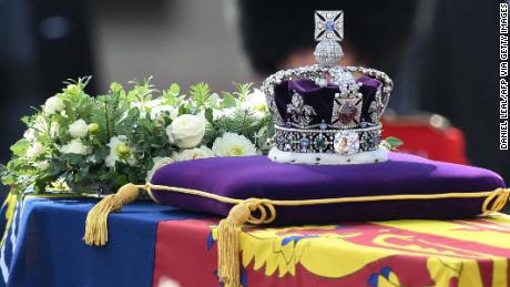 The coffin, covered with the Royal Standard and adorned with the Imperial State Crown.