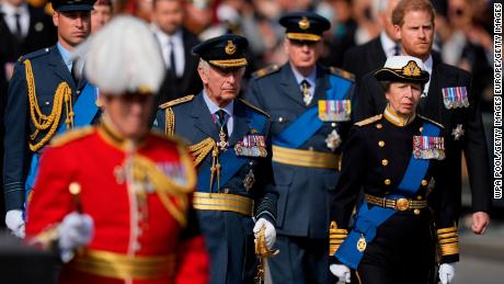 Prince William, King Charles III, Princess Anne and Prince Harry follow Queen Elizabeth II's coffin during the procession from Buckingham Palace to Westminster Hall on September 14, 2022.