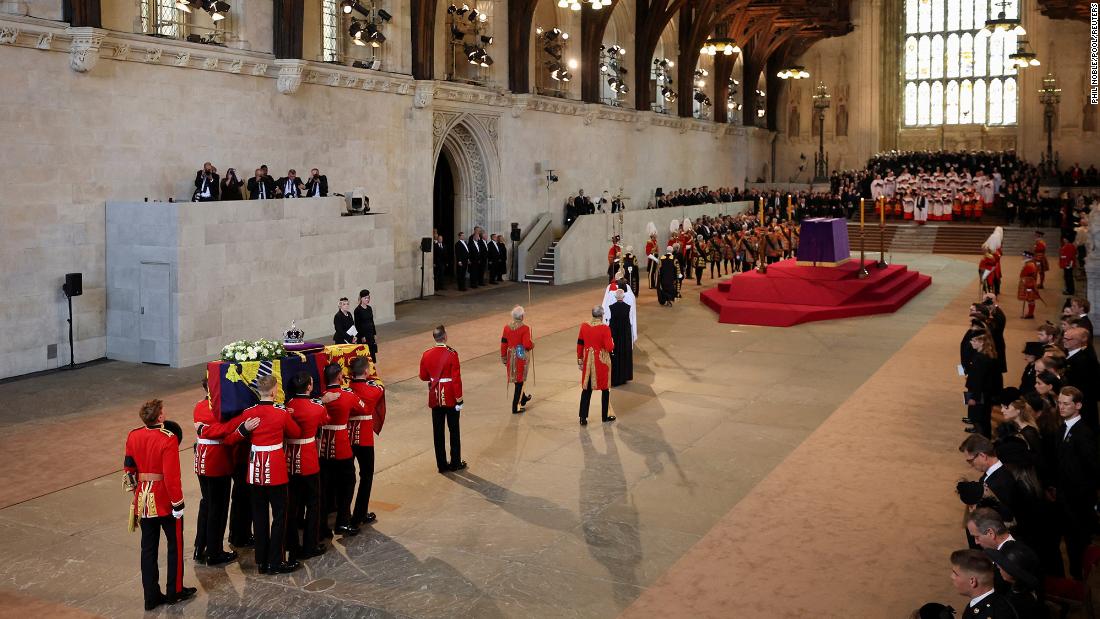 The Queen&#39;s coffin is carried into Westminster Hall.