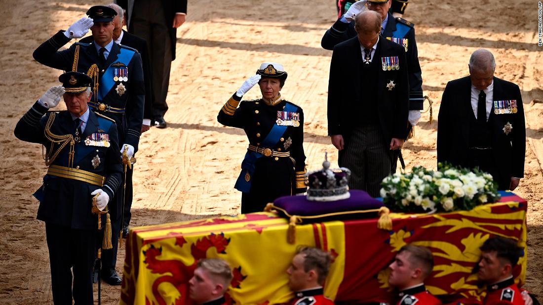 The King, Prince William and Princess Anne salute the Queen&#39;s coffin beside Prince Harry and Prince Andrew on Wednesday.