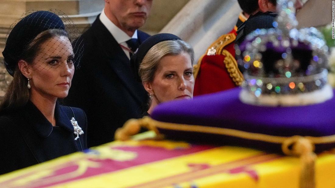 Catherine, the Princess of Wales, and Sophie, the Countess of Wessex, watch the Queen&#39;s coffin arrive at Westminster Hall on Wednesday. The coffin was adorned with the Imperial State Crown.
