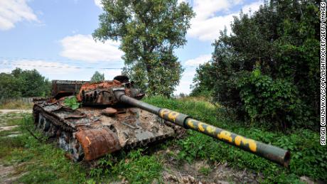A destroyed Russian tank overgrown by plants in the village of Lukashivka, in the Chernihiv region of Ukraine.