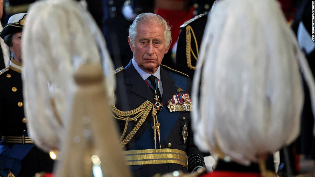 The King watches his mother&#39;s coffin arrive at Westminster Hall.