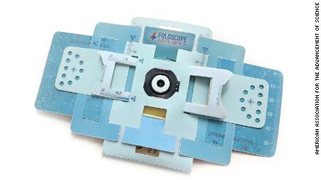 A Foldscope, a powerful microscope made from paper, is shown. 