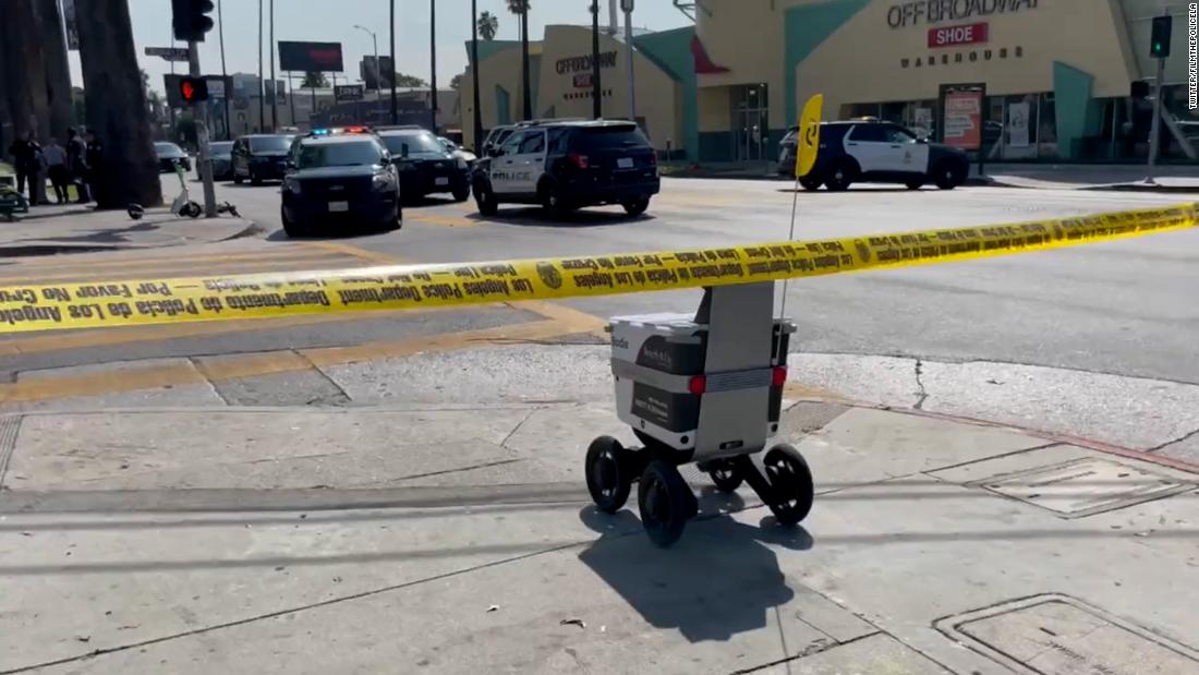 Delivery robot through crime scene | CNN Business