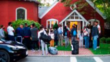 Immigrants gather with their belongings outside St. Andrews Episcopal Church, Wednesday Sept. 14, 2022, in Edgartown, Mass., on Martha&#39;s Vineyard. Florida Gov. Ron DeSantis on Wednesday flew two planes of immigrants to Martha&#39;s Vineyard, escalating a tactic by Republican governors to draw attention to what they consider to be the Biden administration&#39;s failed border policies. (Ray Ewing/Vineyard Gazette via AP)