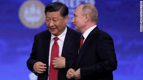 Chinese President Xi Jinping and Russian President Vladimir Putin appear after a session of the St. Petersburg International Economic Forum.