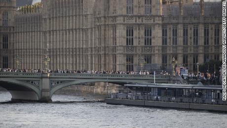 Members of the public queue to see the Queen&#39;s coffin on Wednesday.