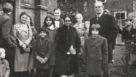The writer&#39;s family outside a church in Cambridge, UK, after leaving Uganda in 1972. Lucy&#39;s grandmother Rachel, center, wears a donated fur coat. 