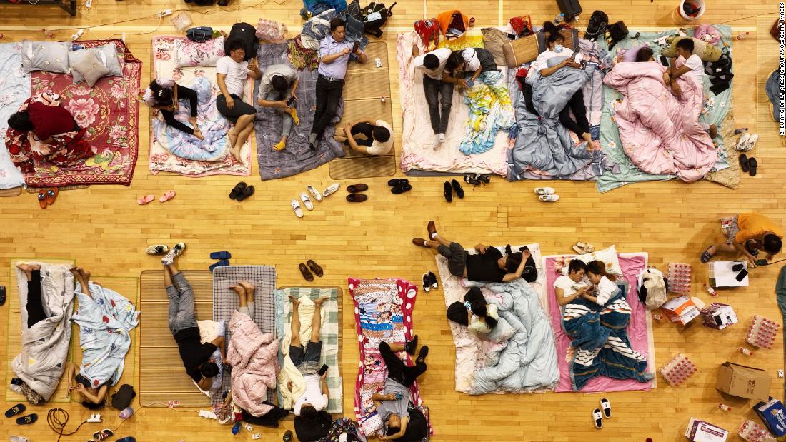 Migrant workers in Zhoushan, China, sleep on the floor of a basketball arena to avoid Typhoon Muifa on Tuesday, September 13. Muifa, the most powerful typhoon of the season so far, &lt;a href=&quot;https://www.cnn.com/2022/09/13/china/typhoon-muifa-shanghai-ports-intl-hnk&quot; target=&quot;_blank&quot;&gt;made landfall on Wednesday.&lt;/a&gt;