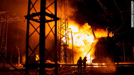 Ukrainian firefighters put out a fire after a Russian rocket attack on an electric power station in Kharkiv on Sunday, September 11, 2022.
