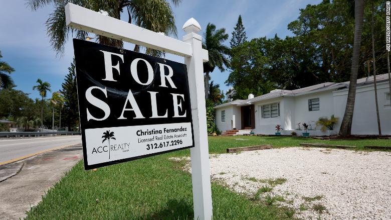 MIAMI, FLORIDA - JUNE 21: A &#39;for sale&#39; sign hangs in front of a home on June 21, 2022 in Miami, Florida. (Photo by Joe Raedle/Getty Images)