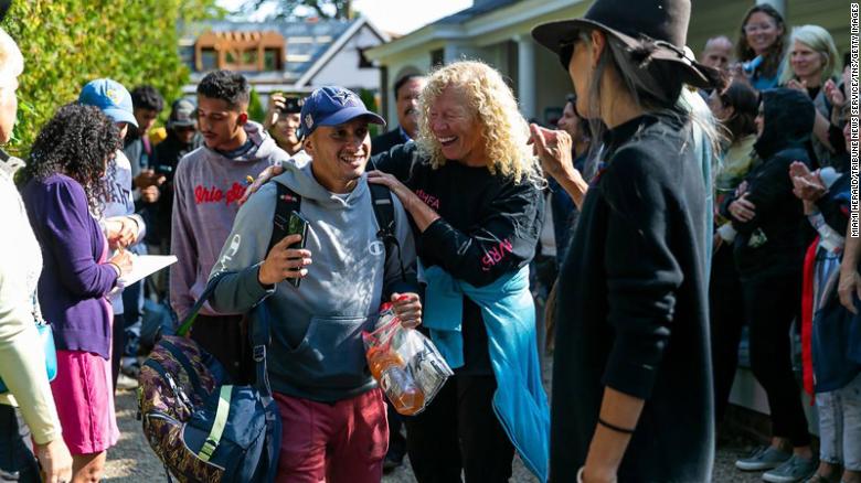 A Venezuelan migrant reacts as he is led onto a bus at St. Andrews Episcopal Church on Sept. 16, 2022, in Edgartown, Massachusetts, on the island of Martha&#39;s Vineyard.