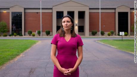 Christina Ellegood, 40, stands in front of Heath High School.