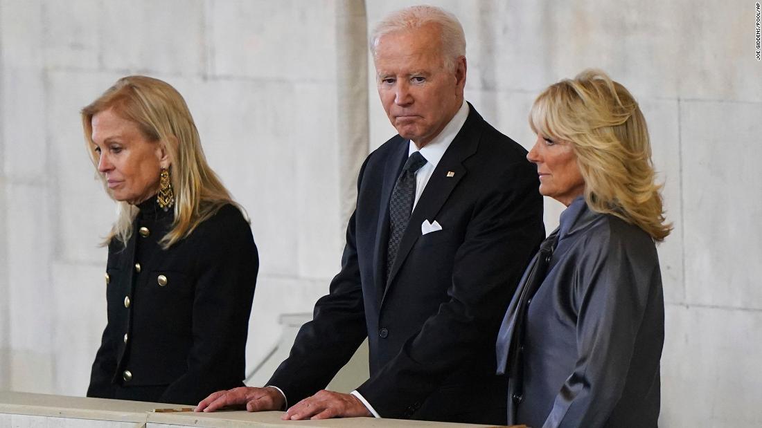 US President Joe Biden and first lady Jill Biden, right, view the Queen&#39;s coffin on Sunday. They were accompanied by Jane Hartley, the US ambassador to the United Kingdom.