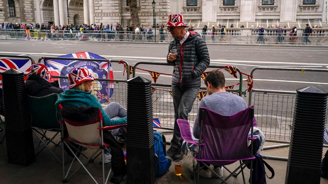 To get a spot ahead of the Queen&#39;s funeral procession on Monday, people camp out Sunday along Whitehall, a street that cuts through London&#39;s government district.