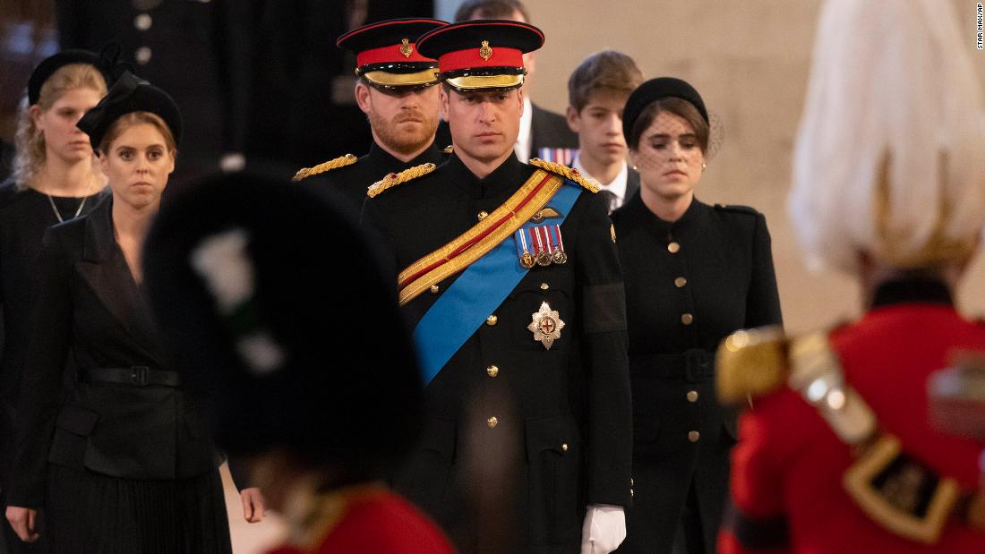 Prince William and Prince Harry lead the Queen&#39;s grandchildren into Westminster Hall to stand vigil at her coffin on Saturday.