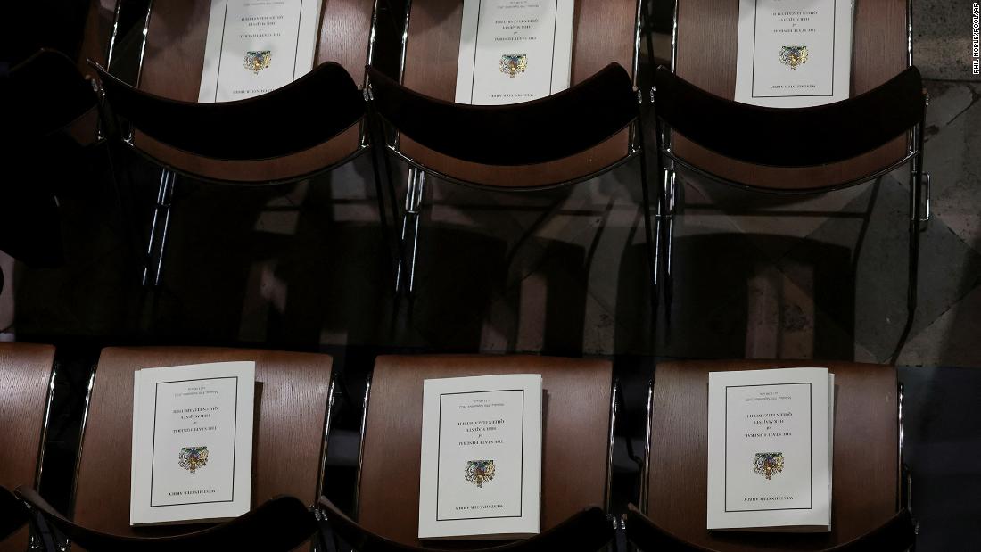 Funeral programs are left on chairs at Westminster Abbey.