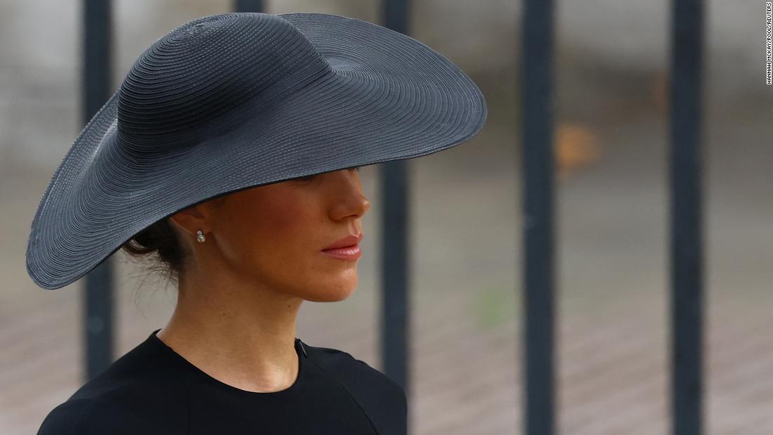 Meghan, the Duchess of Sussex, walks outside Westminster Abbey.