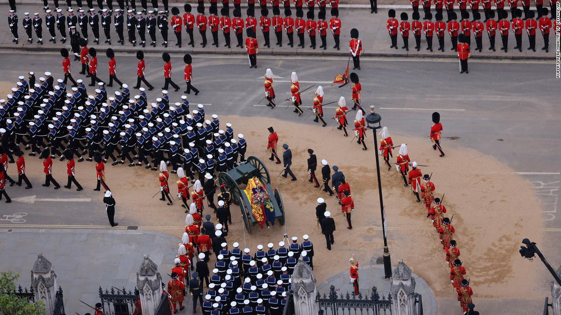 Members of the British Armed Forces march during the funeral procession.