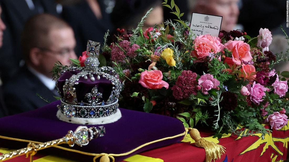 &lt;a href=&quot;https://www.cnn.com/2022/09/19/europe/queen-funeral-coffin-note-charles-gbr-intl-scli/index.html&quot; target=&quot;_blank&quot;&gt;A handwritten card&lt;/a&gt; placed on top of the Queen&#39;s coffin reads, &quot;In loving and devoted memory. Charles R.&quot; The &quot;R&quot; in King Charles&#39; title refers to &quot;Rex,&quot; which is Latin for king.