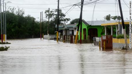 A flooded street is seen after the passage of hurricane Fiona in Salinas, Puerto Rico, on September 19, 2022. - Hurricane Fiona smashed into Puerto Rico, knocking out the US island territory&#39;s power while dumping torrential rain and wreaking catastrophic damage before making landfall in the Dominican Republic. (Photo by Jose Rodriguez / AFP) (Photo by JOSE RODRIGUEZ/AFP via Getty Images)