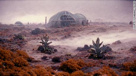 For this &quot;Salt&quot; image, Stelzer, used Midjourney with the prompt &quot;film still of a research station on a mining planet, sci-fi atmosphere, beige and dark, 1980s sci-fi movie, tense atmosphere, rare alien plants and vegetation, arid, dusty, fog.&quot;