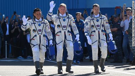 Russian cosmonauts Sergey Prokopyev (C) and Dmitri Petelin (R) and NASA astronaut Frank Rubio, members of the International Space Station (ISS) Expedition 68 main crew, walk to report to Russia&#39;s Roscosmos space agency head prior to the launch at the Russian leased Baikonur cosmodrome in Kazakhstan on September 21, 2022. - The trio is scheduled to launch aboard their Soyuz MS-22 spacecraft on September 21. (Photo by NATALIA KOLESNIKOVA / AFP) (Photo by NATALIA KOLESNIKOVA/AFP via Getty Images)